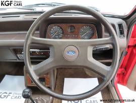 A Luxurious Mk1 Ford Fiesta 1300 Ghia , Sunburst Red, £ 10,995
